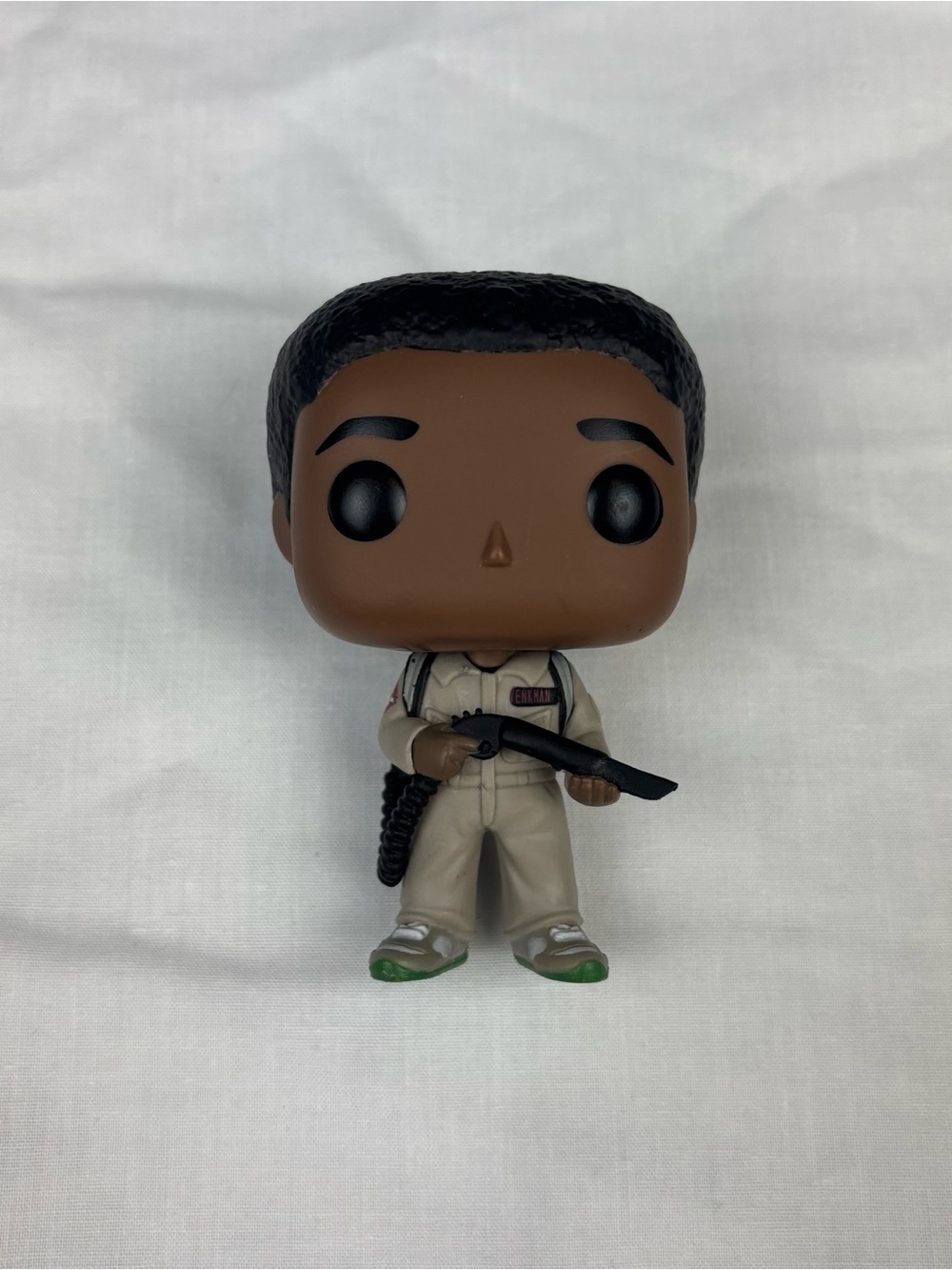 Funko Ghostbuster Vinyl Figure with Beige Outfit and Green Shoes